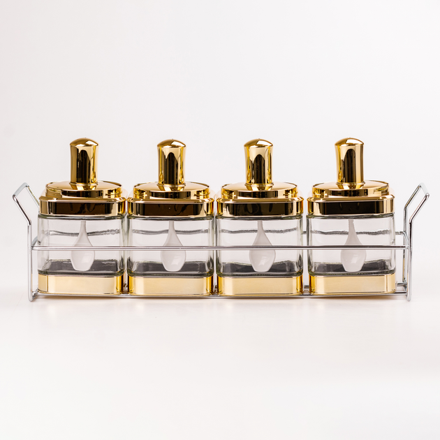 Set of jars for bulk products 4 pieces with a spoon on a stand, gold